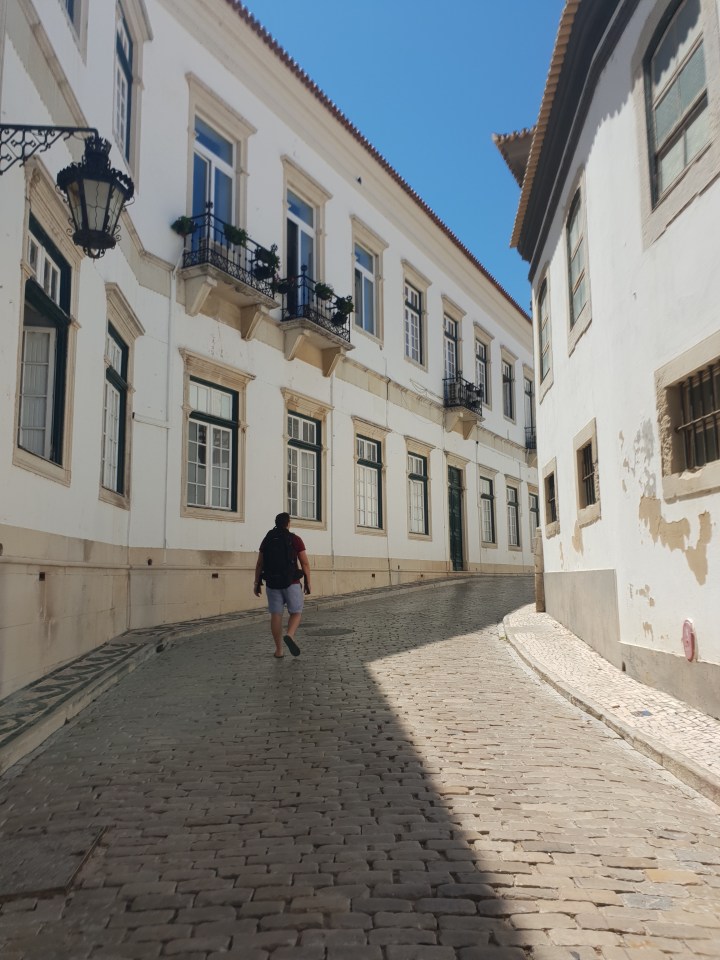 Faro, Portugal,  walking streets, white buildings, 4 freckled faces 