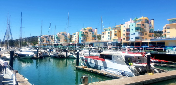 Albufeira Marina, Portugal, pastle coloured buildings, boats, harbour,
