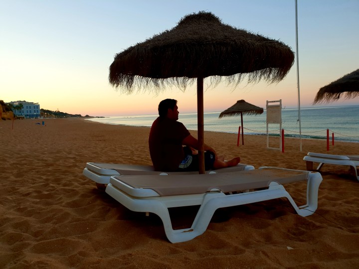Sunrise, sunrise on the beach, Portugal, Algarve, pretty, beautiful, man sitting and relaxing
