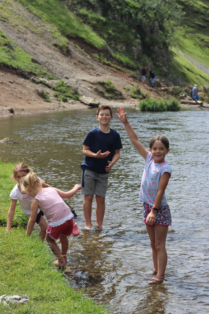 Dovedale. River. Children playing in a river. England. 4 Freckled Faces
